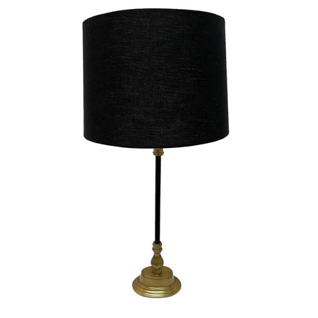 Sleek aluminium table lamp in black and brass finish with black linen shade, ideal for modern decor and warm ambiance.