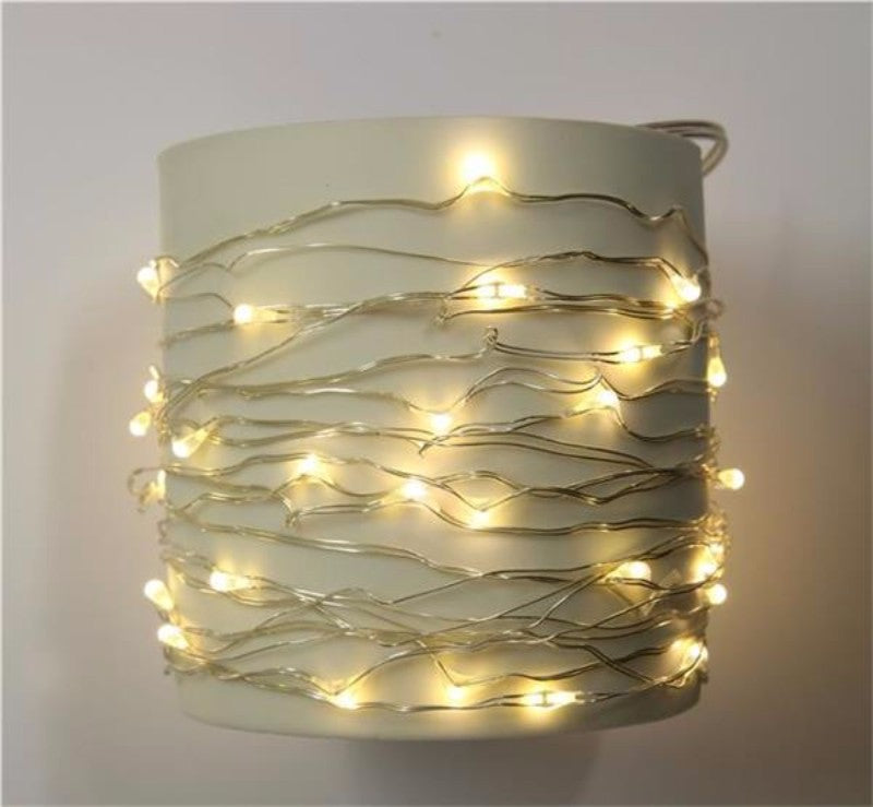 LED string lights with 67 warm bulbs on a silver wire, perfect for indoor and outdoor ambiance decoration.