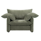 Luxurious sage armchair with solid pine frame, plush foam fill, and feather pillow, perfect for stylish relaxation.