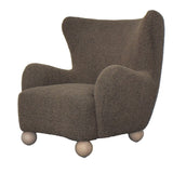 Dark grey OLIVER CHAIR with overstuffed arms and contoured seat, offering comfort and style for modern living spaces.