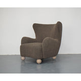 Stylish dark grey OLIVER CHAIR with overstuffed arms and contoured seat, perfect for modern living spaces.