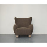 Stylish OLIVER CHAIR in dark grey with overstuffed arms and rounded feet, perfect for modern living spaces.