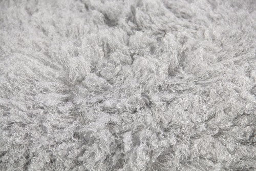 Plush grey crimped long hair throw, 150 x 180 cm, with ultra-soft texture and micro mink backing for added comfort.