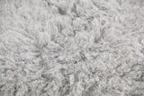 Soft grey crimped long hair throw measuring 150 x 180 cm, perfect for warmth and elegant home decor.