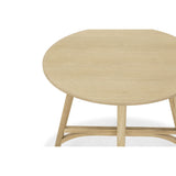 Nordic Oak coffee side table with a 60cm round top, showcasing clean lines and rich grain patterns for elegant living.