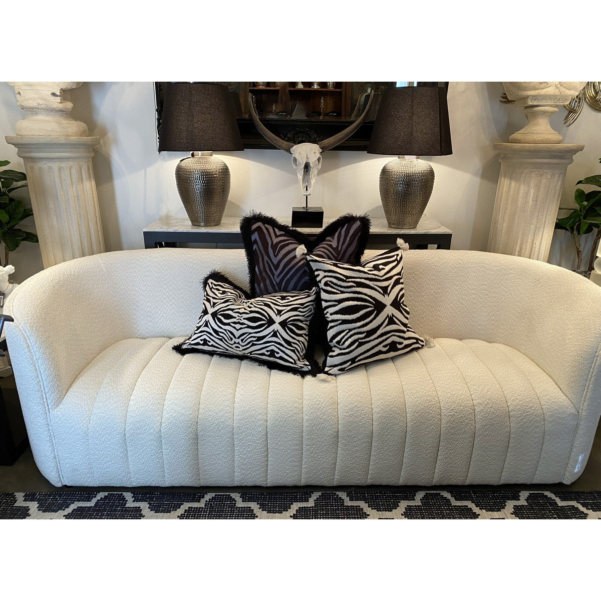 Hand-embroidered black cotton-viscose velvet cushion cover with fringes, adding elegance and sophistication to any space.