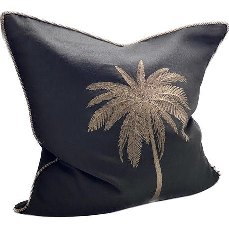 Intricate black and gold hand-embroidered cushion cover, perfect for elevating home decor with elegance and luxury.