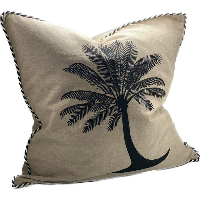 Elegant natural and black hand-embroidered cushion cover adding luxury and charm to any living space.