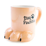 3D beige mug shaped like a dog's paw with "Stay Pawsitive" phrase, perfect gift for dog lovers.