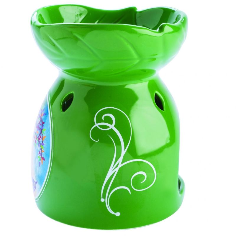 Elegant oil burner featuring a Tree of Life design, perfect for oils and candles to enhance ambiance and tranquility.