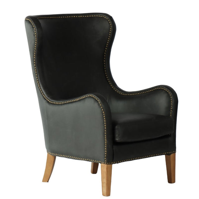 Highback armchair in black leather with an olive velvet backrest and brass studs, offering luxury and comfort for stylish interiors.