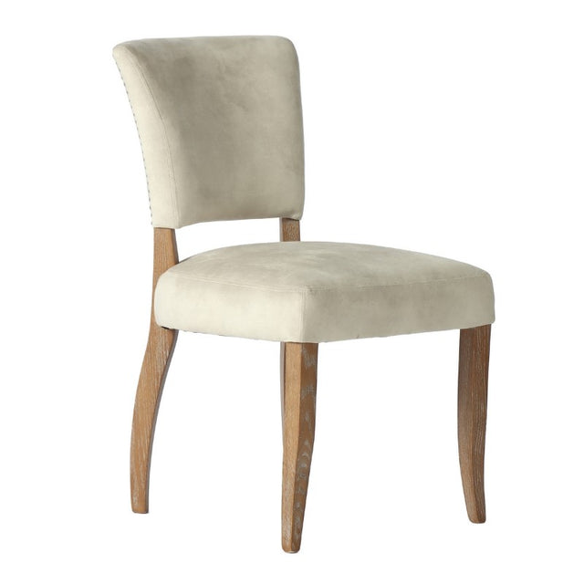 Luxurious Eskimo Velvet dining chair with silver studs, solid ash wood frame, combining comfort and style for elegant dining.