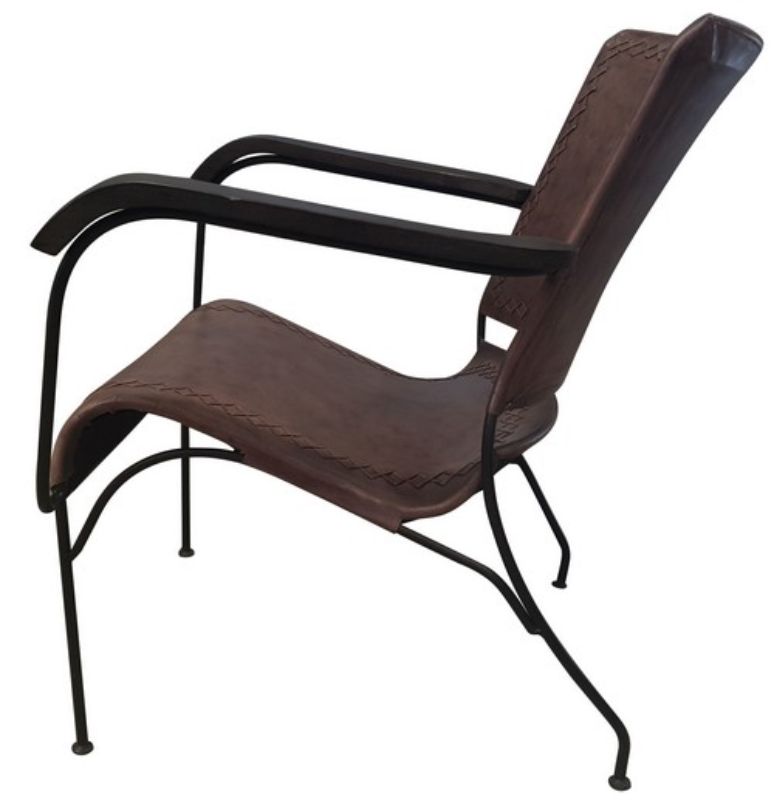 Luxurious buffalo leather armchair with a solid metal frame, perfect for modern and industrial interiors.