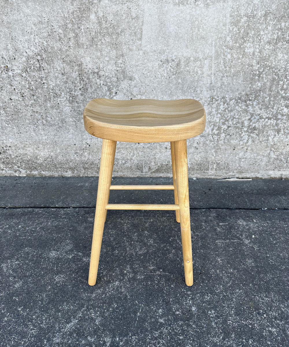 Natural Tractor Stool (65cm) made of durable Toon wood, featuring a rustic design perfect for kitchens or workshops.