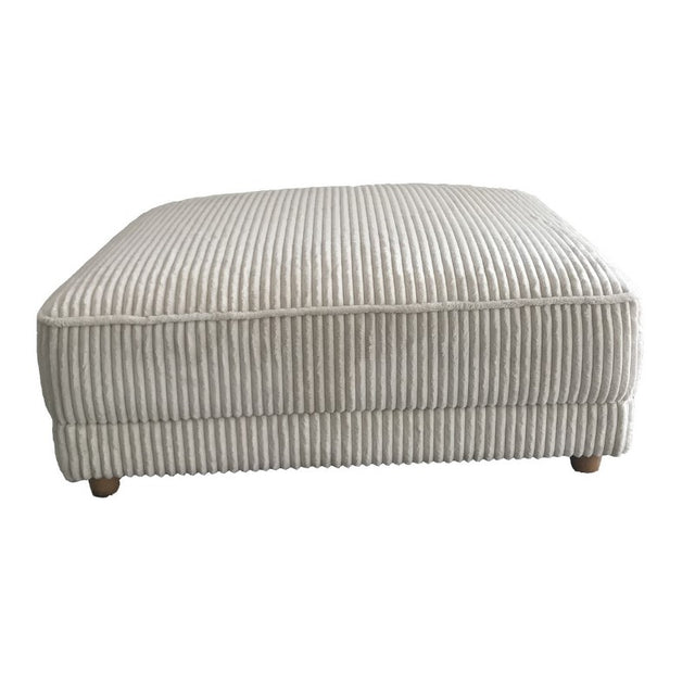 Elegant ivory corduroy ottoman measuring 102 x 42 cm, perfect as a footrest or extra seating for modern and traditional spaces.