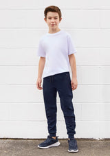 Kids Neo Pant in black, size 8, featuring a soft waistband, zippered pockets, and slim leg design for active comfort.