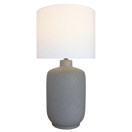 Brown ceramic lamp with white cotton shade, stylish design for any room, creating a warm ambiance and functional lighting.