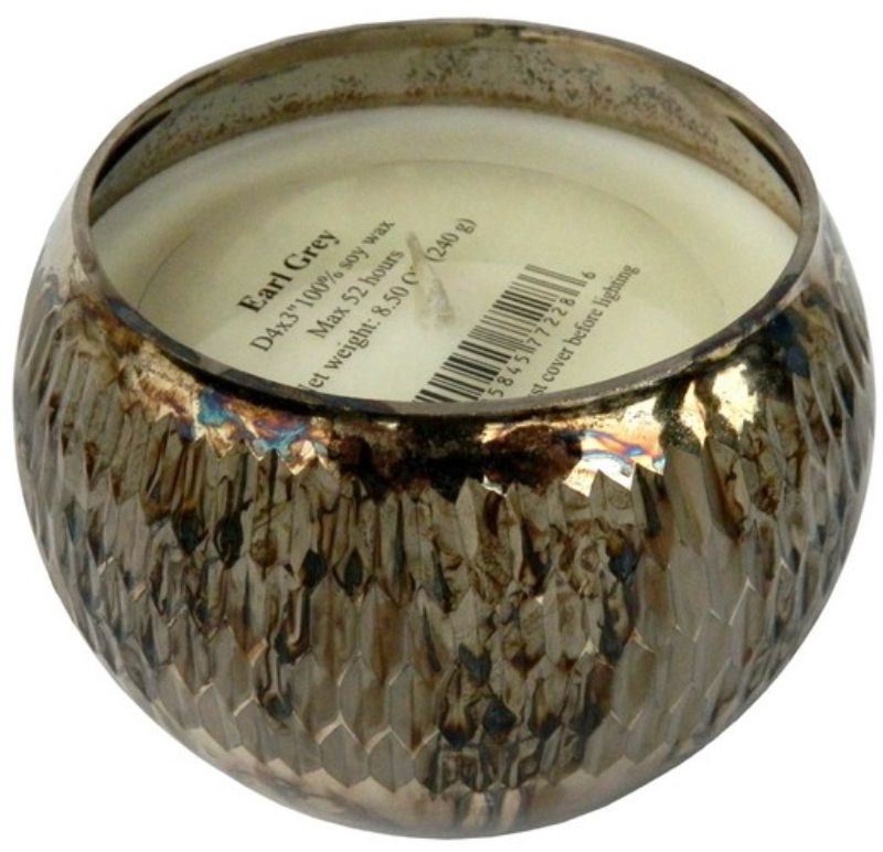 Scented soy wax candle in gold ribbed holder, infusing spaces with calming Earl Grey aroma, perfect for decor and relaxation.