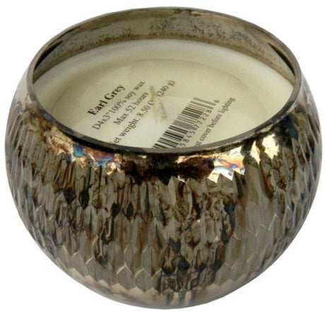 Scented soy wax candle in gold ribbed holder, infusing spaces with calming Earl Grey aroma, perfect for decor and relaxation.