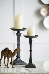 Matte black 34cm Ravello Candle Holder, crafted from iron, perfect for showcasing pillar candles with stylish elegance.