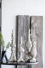 Danna Finial Accent, 46cm tall decorative piece in weathered white, blends classic design with durability for indoor/outdoor use.
