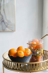 Vibrant artificial oranges in a bowl, crafted from durable PVC, ideal for enhancing home decor with a realistic touch.