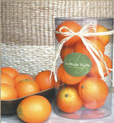 Vibrant artificial oranges in PVC, perfect for enhancing home decor and adding color to bowls or vases.