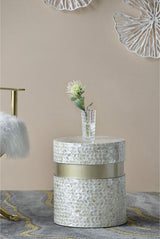 Geometric footstool in tan and gold, featuring capiz inlay and cylindrical design, perfect as a stylish accent or side table.