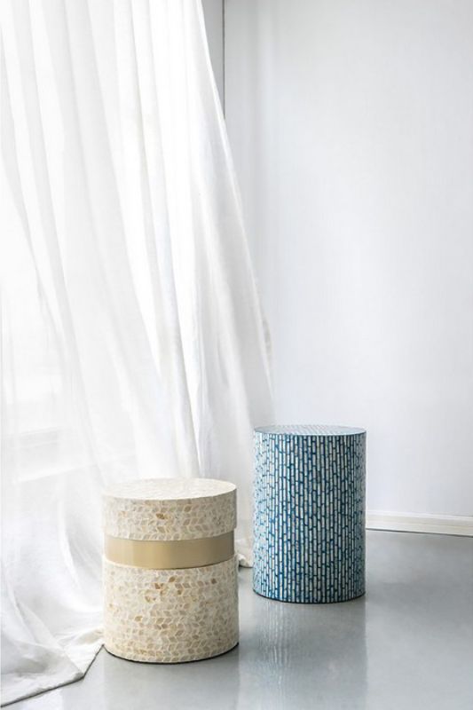 Geometric tan and gold footstool with capiz inlay, perfect as a stylish accent or functional side table.