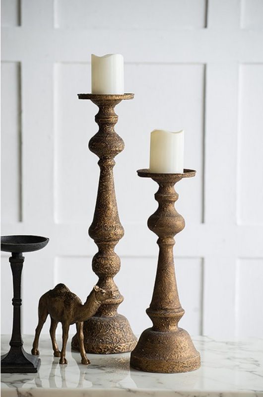 Tall black iron candle holder (61cm) featuring a minimalist design, perfect for enhancing home decor and ambiance.