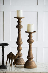 Tall black iron candle holder (61cm) featuring a minimalist design, perfect for enhancing home decor and ambiance.