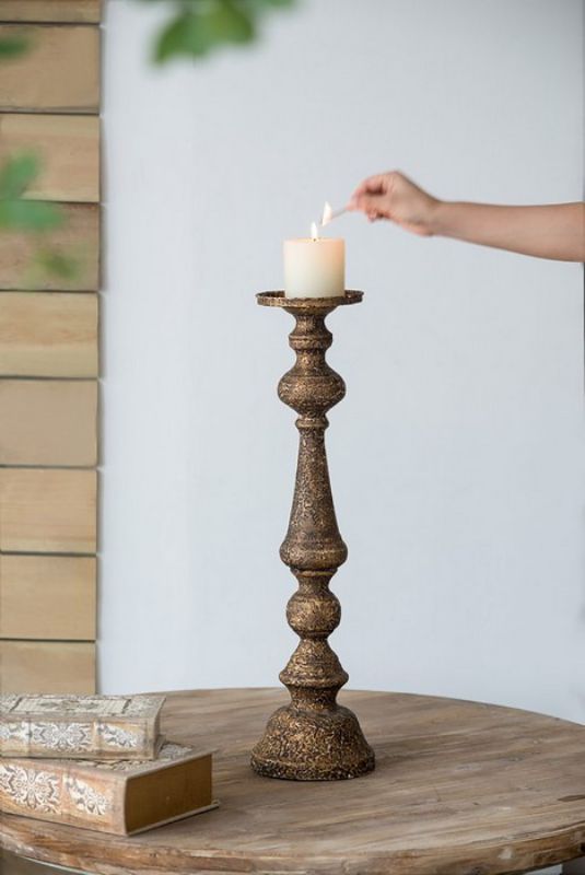 Elegant 61cm black iron candle holder, perfect for enhancing ambiance in any room with style and functionality.
