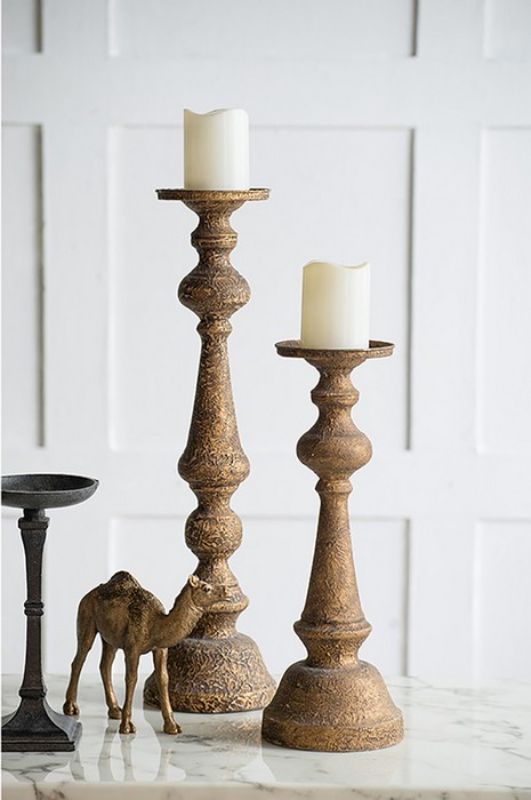 Sleek 44.5cm iron candle holder, perfect for elegant decor and creating a warm ambiance with pillar candles.
