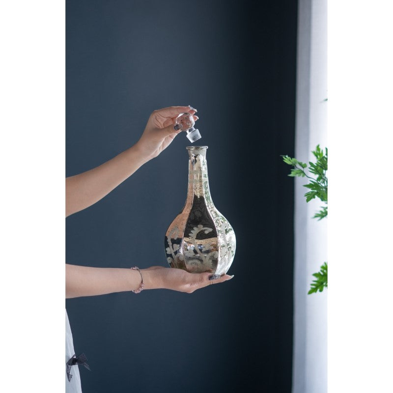 Antique mirrored vase (12.5 x 30.5cm) reflecting light, ideal for flowers or as a decorative centerpiece in any decor.