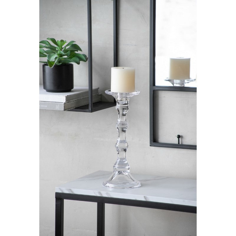 Elegant glass candle stick measuring 12 x 30cm, perfect for modern or classic decor, enhancing ambiance with warm light.