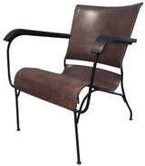 Luxurious leather armchair with a solid metal frame, blending earthy tones and postmodern design for stylish comfort.