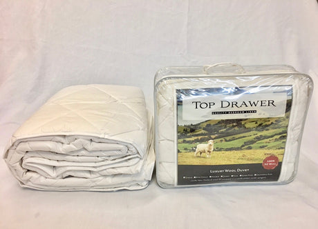 Luxurious 450GSM double duvet inner made of 100% New Zealand wool with breathable cotton outer for year-round comfort.