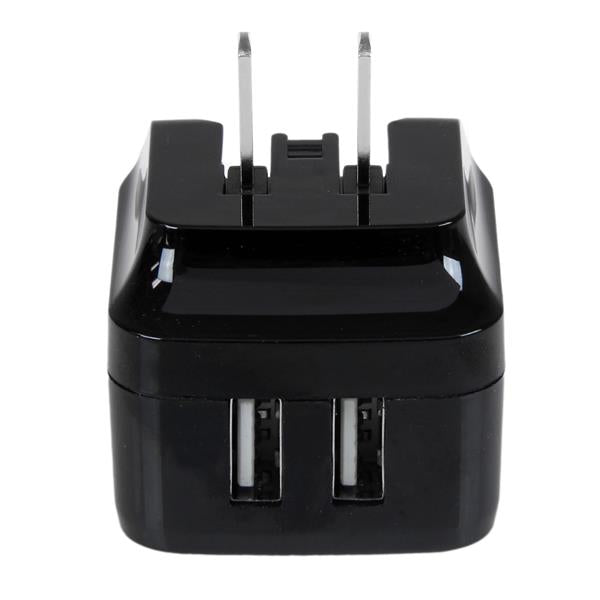 Dual-Port USB wall charger in black, with 17W/3.4A output, perfect for international travel and simultaneous device charging.