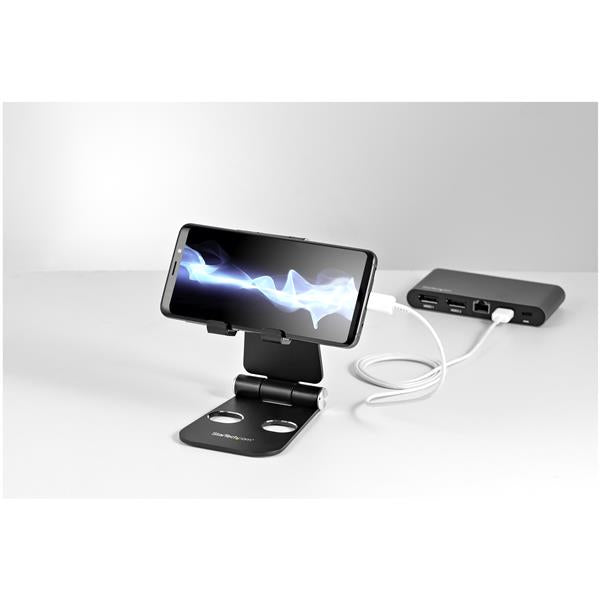 Adjustable aluminum phone and tablet stand for devices 4” to 13”, ensuring comfort and stability for multitasking.