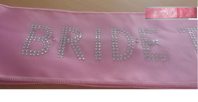 Light pink "Bride To Be" sash with five flashing lights, perfect for hen parties and bridal showers.