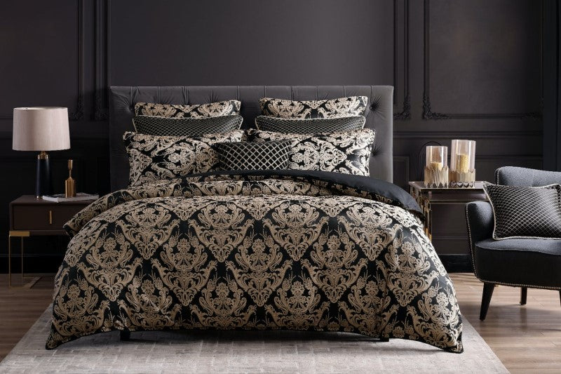 Luxurious Vercelli Noir Queen Duvet Cover Set featuring gold medallion motifs on black, with elegant twisted rope cord accents.