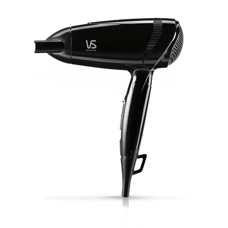 Compact VS Sassoon Traveller 2000 Hair Dryer with 2000 watts, dual-voltage, and folding handle for easy travel styling.