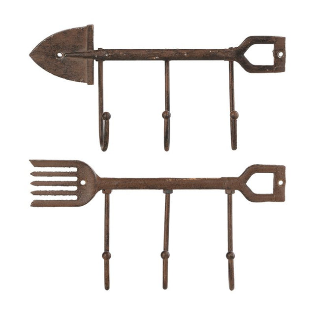 Rustic cast iron wall hook shaped like a spade and fork, featuring three sturdy hooks for organizing tools or decor.