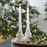 Elegant white ceramic tree candle holders, 8cm high, perfect for festive decor and creating a cozy holiday ambiance.