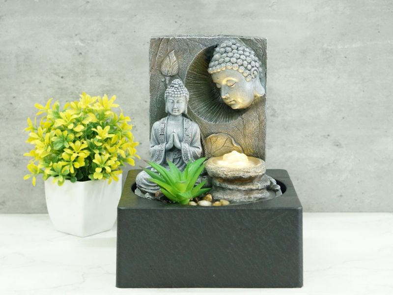 Elegant 25cm Meditating Buddha water feature, creating serene ambiance with flowing water and warm white light for relaxation.