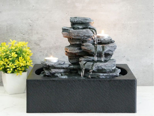 Enchanting 29cm rock pool water feature with warm white light, perfect for creating a tranquil indoor or outdoor ambiance.