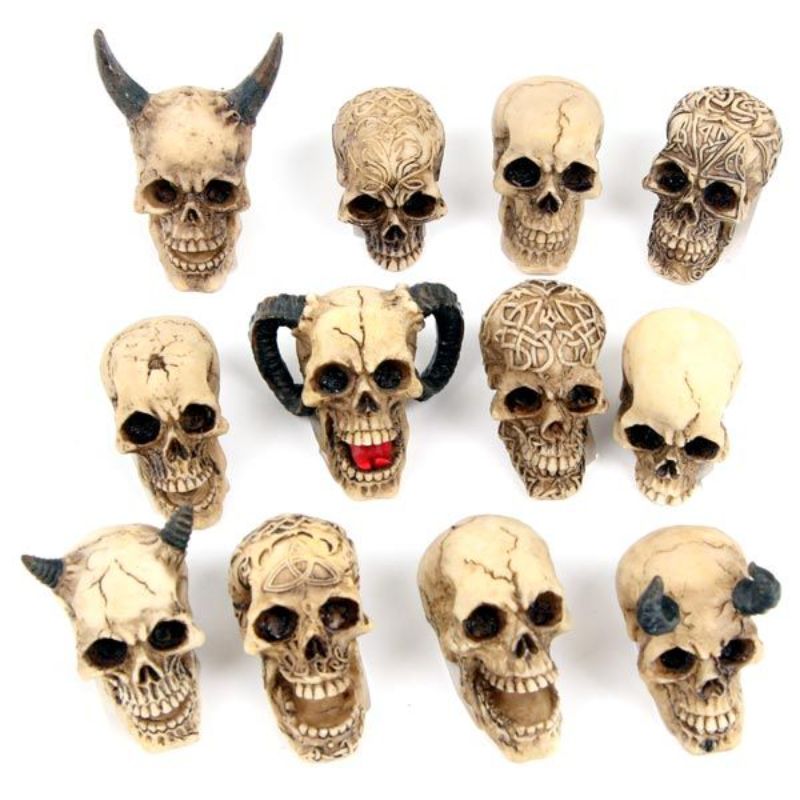 Set of 12 unique skull figurines, 2-5cm tall, perfect for Halloween decor and creative displays.