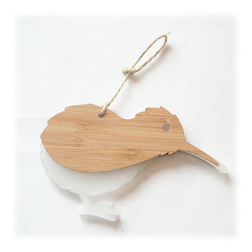 Eco-friendly Kiwi Ornament made of laser-cut bamboo and satin acrylic, perfect for holiday decor and gifting.