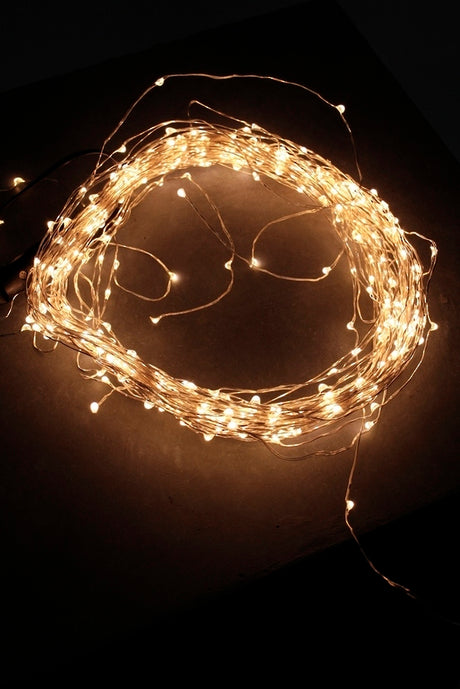 Warm white seed lights with 10 strands and 125 bulbs, perfect for cozy indoor and outdoor decor.