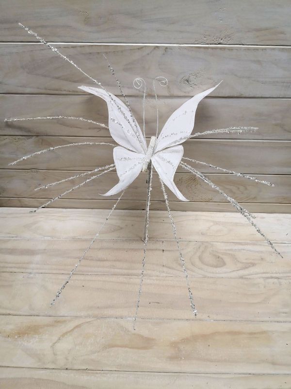 Large white glittered butterfly with long tail, elegantly designed for home decor and special occasions.